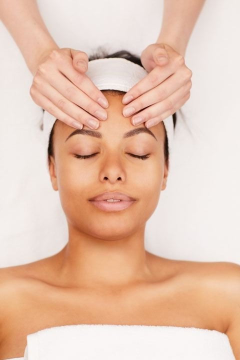 Image of a woman getting a facial treatment