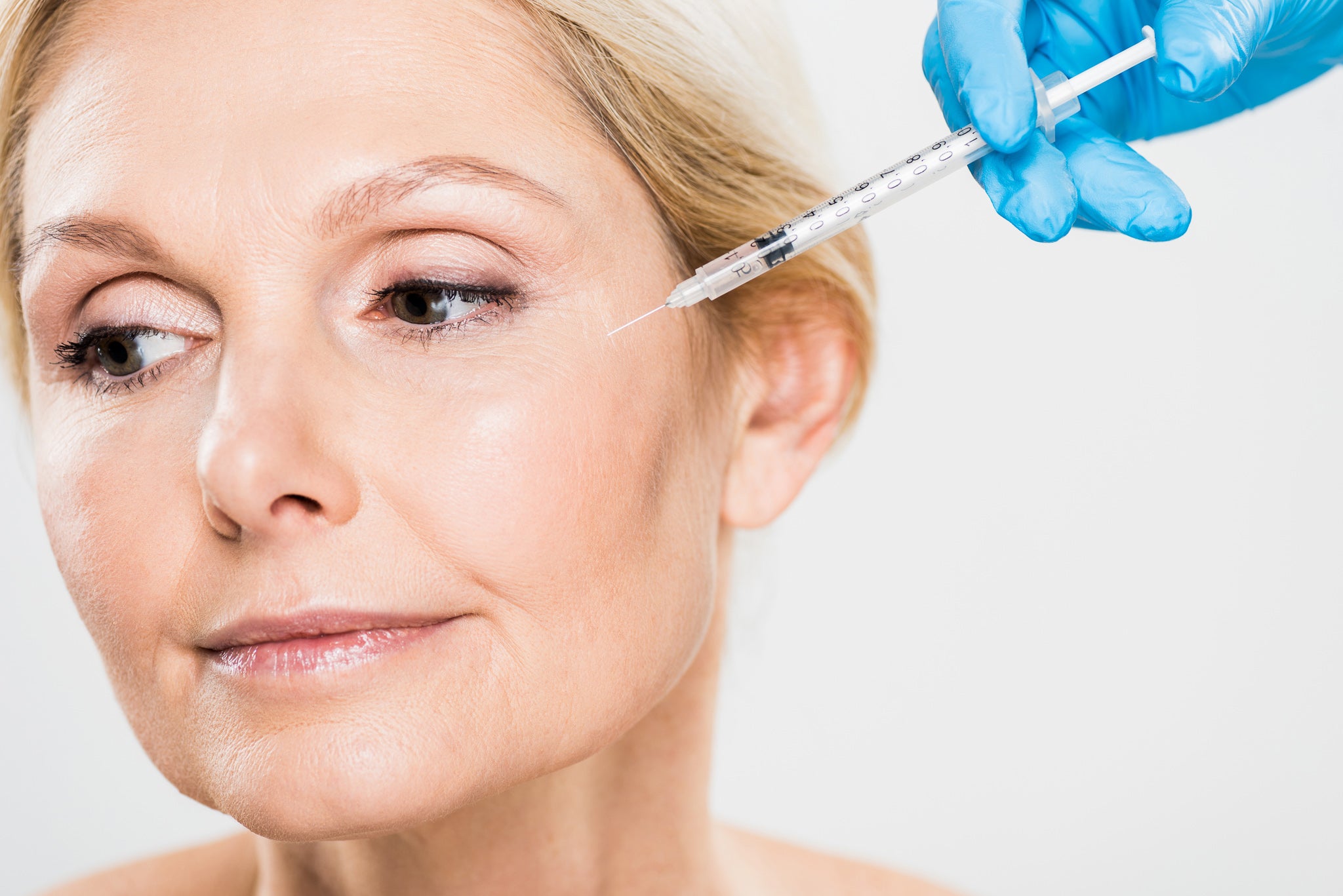 woman with crows feet getting a botox treatment