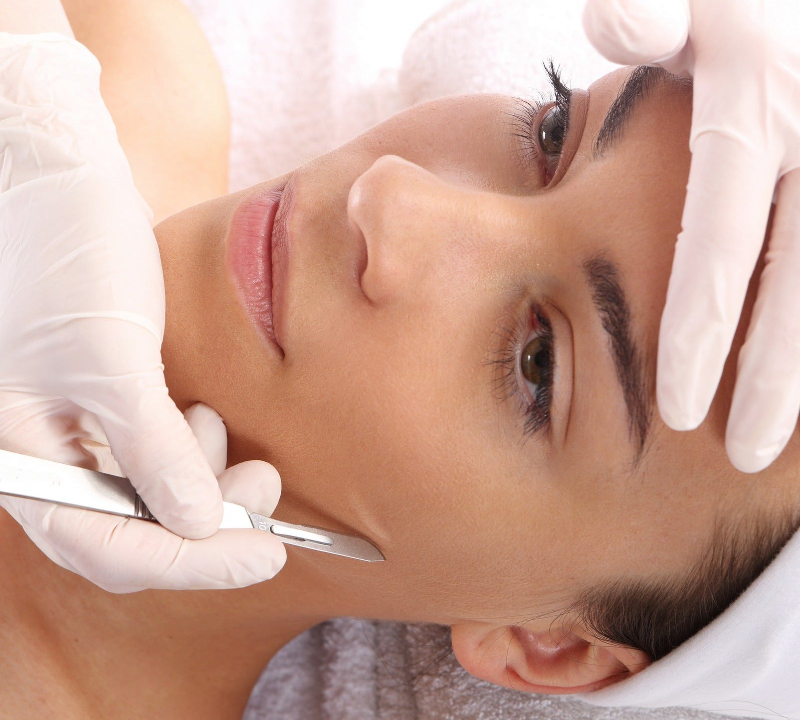 Image of a woman undergoing dermaplaning