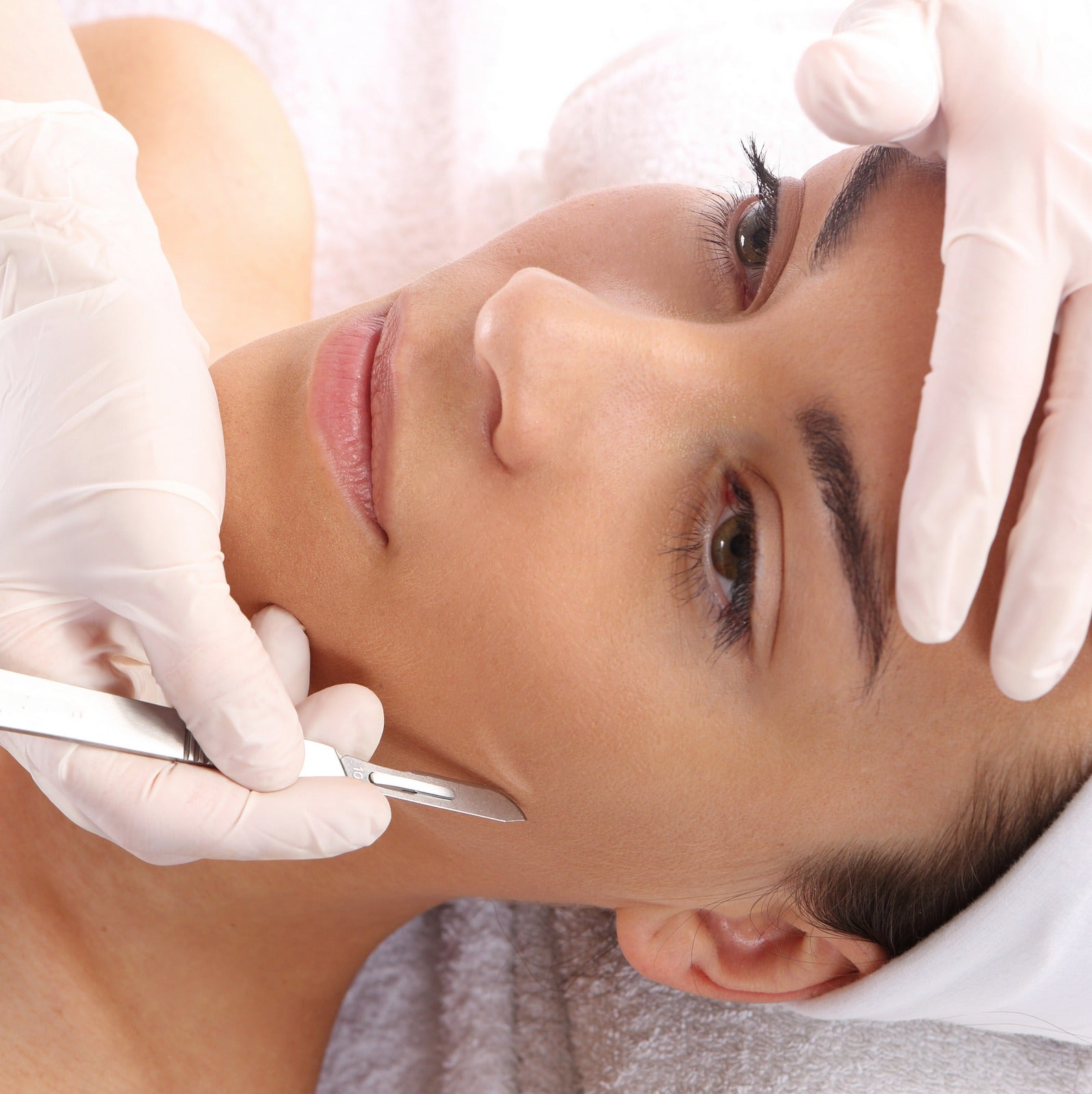 Image of a woman undergoing dermaplaning