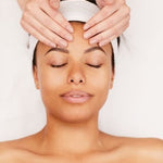 Image of a woman getting a facial treatment