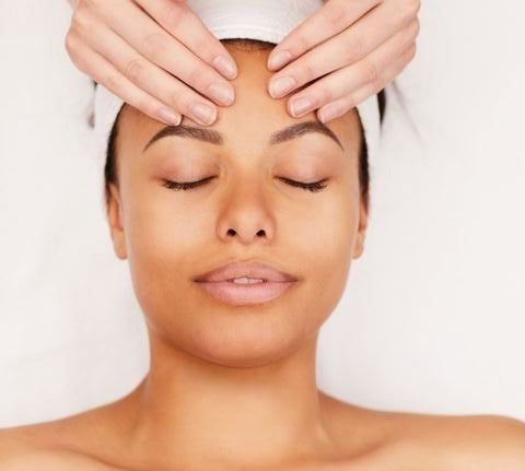Image of a woman getting a facial treatment
