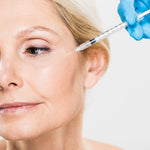 woman with crows feet getting a botox treatment